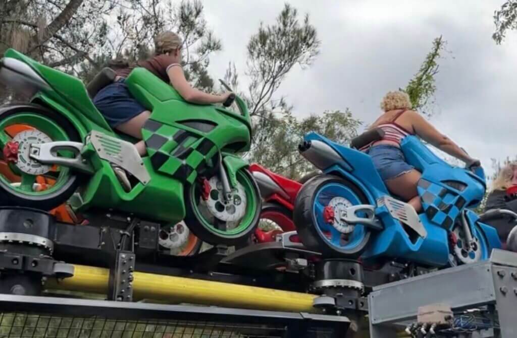 Riders on the motorbike vehicles of Dreamworld's Motocoaster, the ride being replaced by Lost Mine Mayhem